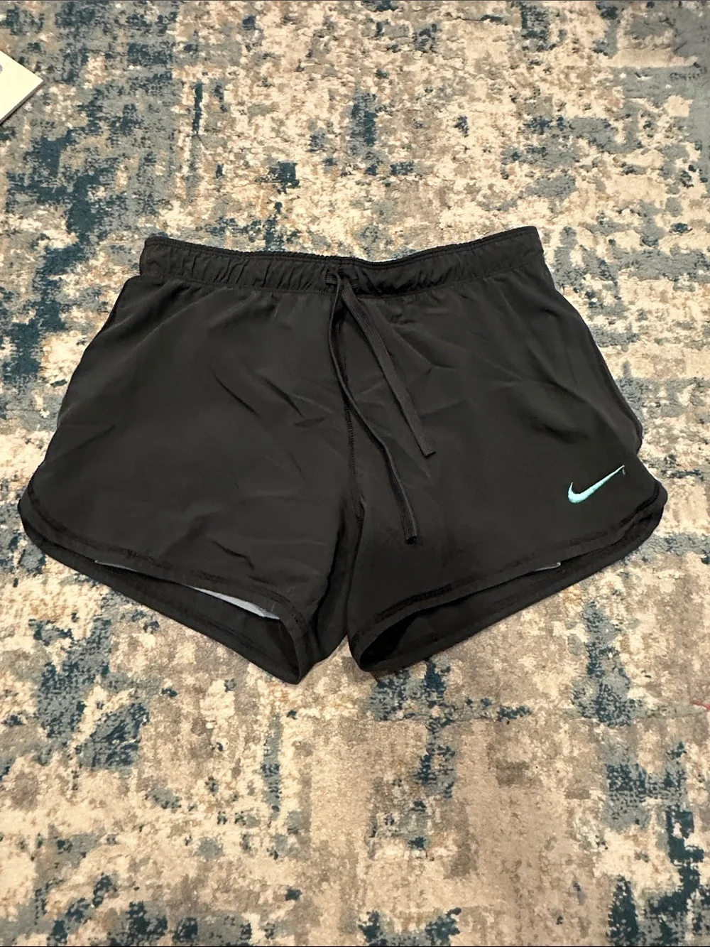 Nike Women's Black Athletic Shorts with Teal Swoosh